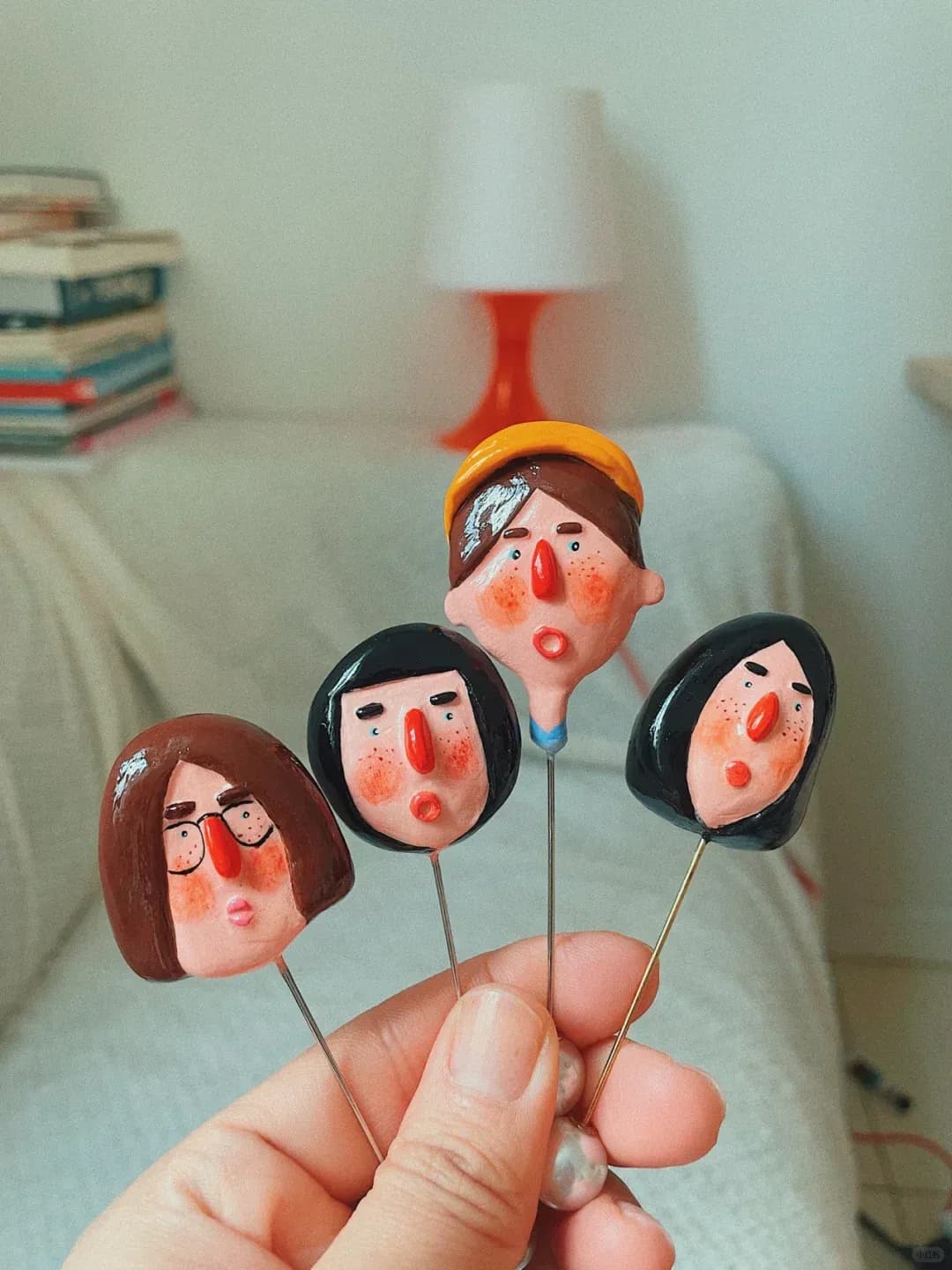 Four handmade character brooches