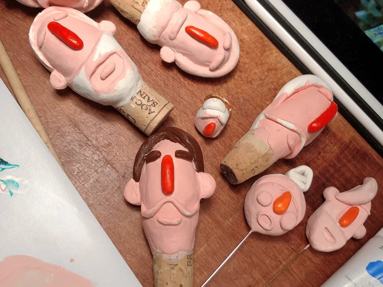 Clay character wine stoppers and small objects in progress